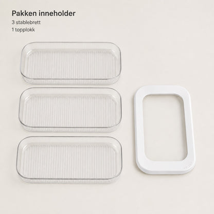 Pakken indeholder tre stabelbare bakker og ét toplåg