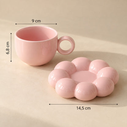 Solsikkekopp i rosa: kopp 9 cm bred og 6,8 cm høy, blomsterfat 14,5 cm