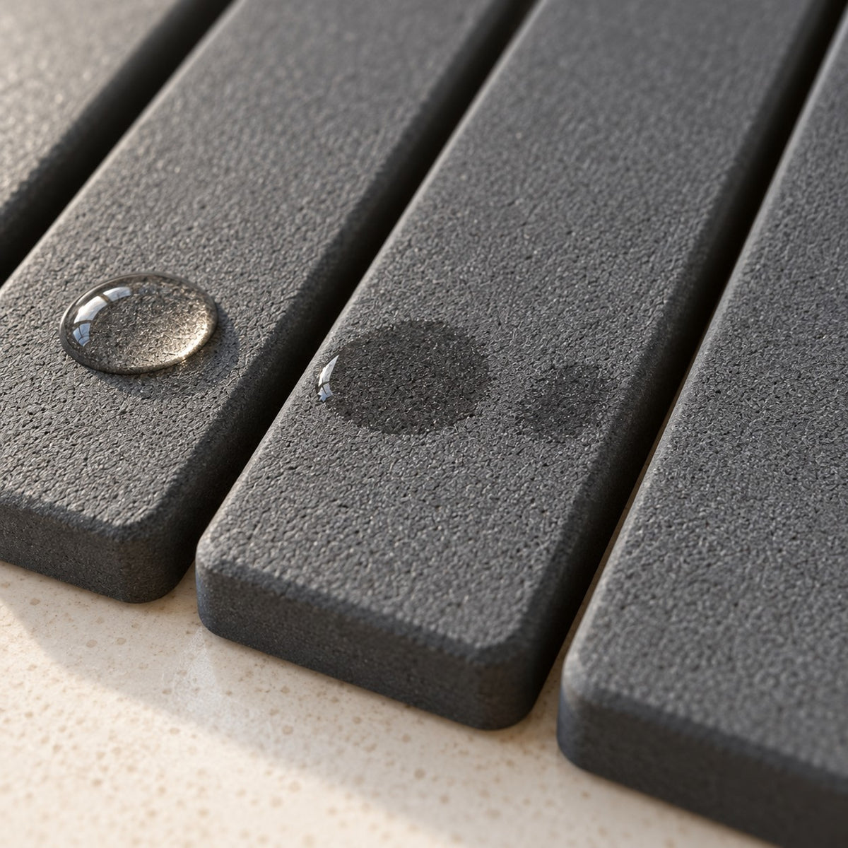 Close-up of the stone mat absorbing water droplets