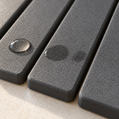 Close-up of the stone mat absorbing water droplets